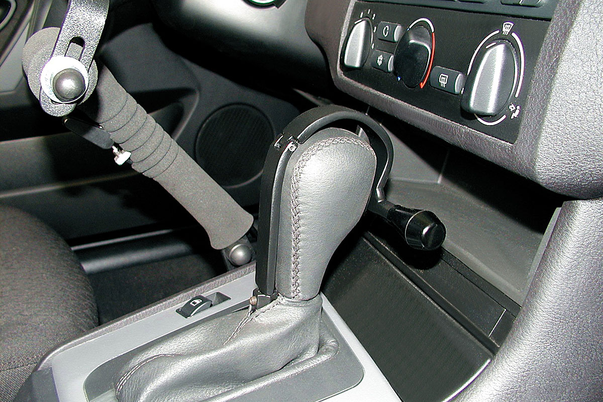 Nástavec páky jízdních režimů – kvadro ve voze BMW 320i